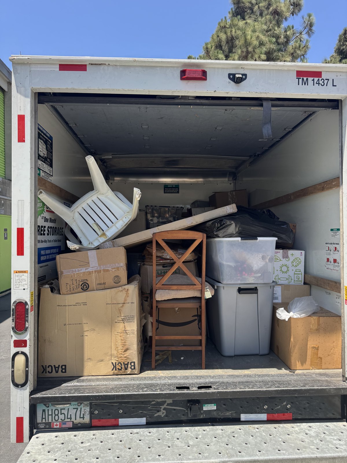 Box truck loaded with furniture and boxes for a Hunky Handyman move